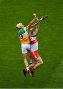1 August 2021; Ross Ravenhill of Offaly in action against Sé McGuigan of Derry during the Christy Ring Cup Final match between Derry and Offaly at Croke Park in Dublin. Photo by Daire Brennan/Sportsfile