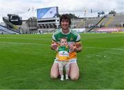 1 August 2021; Offaly captain Ben Conneely with his daughter Liadán, 8 months, on the pitch after his side's victory in the Christy Ring Cup Final match between Derry and Offaly at Croke Park in Dublin. Photo by Piaras Ó Mídheach/Sportsfile