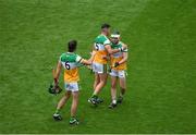 1 August 2021; Offaly players, left to right, Ben Conneely, Aidan Treacy, and Eimhín Kelly celebrate after the Christy Ring Cup Final match between Derry and Offaly at Croke Park in Dublin. Photo by Daire Brennan/Sportsfile
