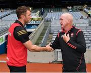1 August 2021; Derry manager Dominic McKinley, right, congratulates Offaly manager Michael Fennelly after the Christy Ring Cup Final match between Derry and Offaly at Croke Park in Dublin. Photo by Ray McManus/Sportsfile