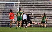 1 August 2021; Emma Troy of Meath shoots to score her side's third goal past Armagh goalkeeper Anna Carr during the TG4 Ladies Football All-Ireland Championship Quarter-Final match between Armagh and Meath at St Tiernach's Park in Clones, Monaghan. Photo by Sam Barnes/Sportsfile