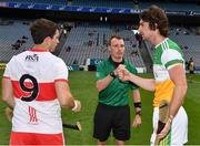 1 August 2021; Referee Thomas Gleeson with the two captains, Ben Conneely of Offaly and Cormac O'Doherty of Derry before the Christy Ring Cup Final match between Derry and Offaly at Croke Park in Dublin.  Photo by Ray McManus/Sportsfile