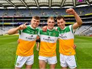 1 August 2021; Brian Duignan, left, Ciarán Burke and Ross Ravenhill of Offaly, right, celebrate victory after the Christy Ring Cup Final match between Derry and Offaly at Croke Park in Dublin.  Photo by Ray McManus/Sportsfile