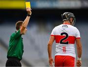 1 August 2021; Referee Thomas Gleeson issues a yellow card to Meehaul McGrath of Derry during the Christy Ring Cup Final match between Derry and Offaly at Croke Park in Dublin.  Photo by Ray McManus/Sportsfile