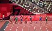 1 August 2021; Zharnel Hughes of Great Britain, left, leaves the track after being disqualified for a false start as Andre de Grasse of Canada, Enoch Adegoke of Nigeria, Ronnie Baker of USA, Bingtian Su of China, Fred Kerley of USA, Lamont Marcell Jacobs of Italy and Akani Simbine of South Africa line up before the men's 100 metres final at the Olympic Stadium on day nine of the 2020 Tokyo Summer Olympic Games in Tokyo, Japan. Photo by Brendan Moran/Sportsfile