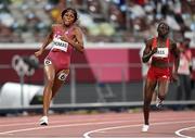 2 August 2021; Gabrielle Thomas of USA, left, and Gina Bass of Gambia in action during the semi-final of the women's 200 metres at the Olympic Stadium on day ten of the 2020 Tokyo Summer Olympic Games in Tokyo, Japan. Photo by Ramsey Cardy/Sportsfile
