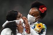 2 August 2021; Silver medalist Kendra Harrison of USA has her facemask adjusted by gold medalist Jasmine Camacho-Quinn of Jamaica during the Women's 100 metre Hurdles Victory Ceremony at the Olympic Stadium on day ten of the 2020 Tokyo Summer Olympic Games in Tokyo, Japan. Photo by Ramsey Cardy/Sportsfile