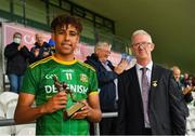 2 August 2021; Pat Teehan, Chairman of the Leinster Council, right, with Sean Emmanuel of Meath after accepting the Electric Ireland Man of the Match Award following the 2021 Electric Ireland Leinster Minor Football Championship Final match between Meath and Dublin at Bord Na Mona O Connor Park in Tullamore, Offaly. Photo by Ray McManus/Sportsfile