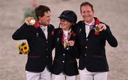 2 August 2021; Team Great Britain members, from left, Tom McEwen, Laura Collett and Oliver Townend celebrate with their gold medals after winning the eventing jumping individual final at the Equestrian Park during the 2020 Tokyo Summer Olympic Games in Tokyo, Japan. Photo by Brendan Moran/Sportsfile