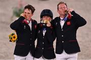2 August 2021; Team Great Britain members, from left, Tom McEwen, Laura Collett and Oliver Townend celebrate with their gold medals after winning the eventing jumping individual final at the Equestrian Park during the 2020 Tokyo Summer Olympic Games in Tokyo, Japan. Photo by Brendan Moran/Sportsfile