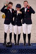 2 August 2021; Team Great Britain members, from left, Tom McEwen, Laura Collett and Oliver Townend celebrate with their gold medals after winning the eventing jumping individual final at the Equestrian Park during the 2020 Tokyo Summer Olympic Games in Tokyo, Japan. Photo by Brendan Moran/Sportsfile