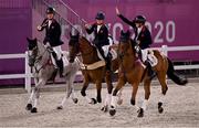 2 August 2021; Team Great Britain members, from left, Oliver Townend, Laura Collett and Tom McEwen celebrate with their gold medals after winning the eventing jumping individual final at the Equestrian Park during the 2020 Tokyo Summer Olympic Games in Tokyo, Japan. Photo by Brendan Moran/Sportsfile