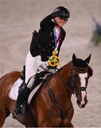 2 August 2021; Julia Krajewski of Germany on Amande de B'Neville celebrates with her gold medal after the eventing jumping individual final at the Equestrian Park during the 2020 Tokyo Summer Olympic Games in Tokyo, Japan. Photo by Brendan Moran/Sportsfile