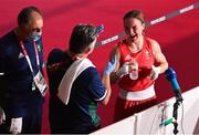 3 August 2021; Kellie Harrington of Ireland with coaches John Conlan, centre, and Zaur Antia after her victory in the women's lightweight quarter-final bout against Imane Khelif of Algeria at the Kokugikan Arena during the 2020 Tokyo Summer Olympic Games in Tokyo, Japan. Photo by Brendan Moran/Sportsfile