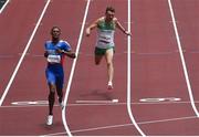 3 August 2021; Marcus Lawler of Ireland, right, and Yancarlo Martinez of Dominican Republic cross the line in the men's 200 metre heats at the Olympic Stadium during the 2020 Tokyo Summer Olympic Games in Tokyo, Japan. Photo by Ramsey Cardy/Sportsfile