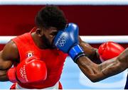 3 August 2021; Andy Cruz of Cuba takes a punch from Wanderson de Oliveira of Brazil during their men's lightweight quarter-final bout at the Kokugikan Arena during the 2020 Tokyo Summer Olympic Games in Tokyo, Japan. Photo by Brendan Moran/Sportsfile
