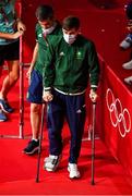3 August 2021; Aidan Walsh of Ireland, wearing a cast, makes his way to the medal ceremony with High performance director Bernard Dunne at the Kokugikan Arena during the 2020 Tokyo Summer Olympic Games in Tokyo, Japan. Photo by Brendan Moran/Sportsfile