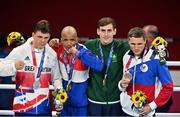 3 August 2021; Aidan Walsh of Ireland with his bronze medal that he won in the men's welterweight division with silver medalist Pat McCormack of Great Britain, left, gold medalist Roniel Iglesias of Cuba, and bronze medalist Andrei Zamkovoi of Russian Olympic Committee at the Kokugikan Arena during the 2020 Tokyo Summer Olympic Games in Tokyo, Japan. Photo by Brendan Moran/Sportsfile