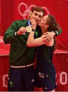 3 August 2021; Michaela Walsh of Ireland kisses her brother Aidan Walsh of Ireland, wearing a cast, with his bronze medal that he won in the men's welterweight division at the Kokugikan Arena during the 2020 Tokyo Summer Olympic Games in Tokyo, Japan. Photo by Brendan Moran/Sportsfile