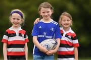 3 August 2021; Carly Quigley, centre, age 8, with Cara Butler, left, age 7, and Sadie Devereux, age 7, during the Bank of Ireland Leinster Rugby Summer Camp at Enniscorthy RFC in Enniscorthy, Wexford. Photo by Matt Browne/Sportsfile