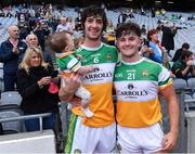 1 August 2021; Offaly captain Ben Conneely with his daughter Liadán, 8 months, and team-mate Luke O'Connor after the Christy Ring Cup Final match between Derry and Offaly at Croke Park in Dublin. Photo by Piaras Ó Mídheach/Sportsfile