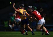 23 July 2021; David Reidy of Clare in action against Cork players, from left, Robert Downey, Ger Millerick and Mark Coleman during the GAA Hurling All-Ireland Senior Championship Round 2 match between Clare and Cork at LIT Gaelic Grounds in Limerick. Photo by Piaras Ó Mídheach/Sportsfile
