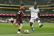 3 August 2021; Ali Coote of Bohemians in action against Anderson Esiti of PAOK during the UEFA Europa Conference League third qualifying round first leg match between Bohemians and PAOK at Aviva Stadium in Dublin. Photo by Ben McShane/Sportsfile