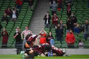 3 August 2021; Bohemians supporters celebrate after their first goal, scored by Ali Coote, hidden, during the UEFA Europa Conference League third qualifying round first leg match between Bohemians and PAOK at Aviva Stadium in Dublin. Photo by Ben McShane/Sportsfile