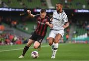 3 August 2021; Andy Lyons of Bohemians in action against Omar El Kaddouri of PAOK during the UEFA Europa Conference League third qualifying round first leg match between Bohemians and PAOK at Aviva Stadium in Dublin. Photo by Ben McShane/Sportsfile