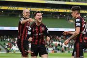 3 August 2021; Ali Coote of Bohemians celebrates after scoring his side's first goal with Georgie Kelly, left, and Dawson Devoy during the UEFA Europa Conference League third qualifying round first leg match between Bohemians and PAOK at Aviva Stadium in Dublin. Photo by Harry Murphy/Sportsfile