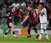 3 August 2021; Ali Coote of Bohemians celebrates with team-mate Ciarán Kelly, right, after scoring his side's second goal as Shinji Kagawa of PAOK reacts during the UEFA Europa Conference League third qualifying round first leg match between Bohemians and PAOK at Aviva Stadium in Dublin. Photo by Harry Murphy/Sportsfile