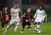 3 August 2021; Ali Coote of Bohemians in action against Jasmin Kurtic and Diego Biseswar of PAOK during the UEFA Europa Conference League third qualifying round first leg match between Bohemians and PAOK at Aviva Stadium in Dublin. Photo by Harry Murphy/Sportsfile