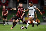 3 August 2021; Conor Levingston of Bohemians in action against Rodrigo Soares of PAOK during the UEFA Europa Conference League third qualifying round first leg match between Bohemians and PAOK at Aviva Stadium in Dublin. Photo by Ben McShane/Sportsfile