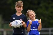 4 August 2021; Adam Manix, age 9, with his sister Ellie, age 8, during the Bank of Ireland Leinster Rugby Summer Camp at Coolmine RFC in Dublin. Photo by Matt Browne/Sportsfile