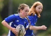 4 August 2021; Poppy Ryan, age 11, in action during the Bank of Ireland Leinster Rugby Summer Camp at Coolmine RFC in Dublin. Photo by Matt Browne/Sportsfile