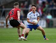 30 July 2021; Donnach Swinburne of Monaghan in action against Ryan Magill of Down during the EirGrid Ulster GAA Football U20 Championship Final match between Down and Monaghan at Athletic Grounds in Armagh. Photo by Piaras Ó Mídheach/Sportsfile