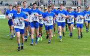 30 July 2021; Monaghan players wears shirts in honour of the late Brendan Óg O Dufaigh, captain of the Monaghan U20 football team who passed away recently, in the warm-up before the EirGrid Ulster GAA Football U20 Championship Final match between Down and Monaghan at Athletic Grounds in Armagh. Photo by Piaras Ó Mídheach/Sportsfile