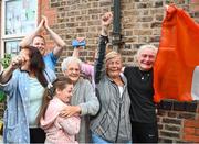5 August 2021; Yvonne Harrington, right, mother of Kellie Harrington, with neighbours including Bernie Atkins, second from right, as Kellie Harrington's family and neighbours celebrate after watching her Tokyo 2020 Olympics lightweight semi-final bout from home at Portland Row in Dublin. Photo by Sam Barnes/Sportsfile