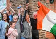 5 August 2021; Yvonne Harrington, right, mother of Kellie Harrington, with neighbours including Lilly May, aged 8, Lilly Fagan and Bernie Atkins, as Kellie Harrington's family and neighbours celebrate after watching her Tokyo 2020 Olympics lightweight semi-final bout from home at Portland Row in Dublin. Photo by Sam Barnes/Sportsfile