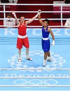 5 August 2021; Kellie Harrington of Ireland, left, raises the hand of Sudaporn Seesondee of Thailand after their women's lightweight semi-final bout at the Kokugikan Arena during the 2020 Tokyo Summer Olympic Games in Tokyo, Japan. Photo by Stephen McCarthy/Sportsfile