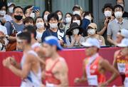 5 August 2021; Spectators wearing facemasks during the men's 20 kilometre walk final at Sapporo Odori Park on day 13 during the 2020 Tokyo Summer Olympic Games in Sapporo, Japan. Photo by Ramsey Cardy/Sportsfile