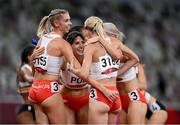 5 August 2021; The Poland team, from left, Iga Baumgart-Witan, Anna Kielbasinska, Malgorzata Holub-Kowalik and Justyna Swiety-Ersetic celebrate finishing in 1st place during round one of the women's 4 x 400 metre relay at the Olympic Stadium on day 13 during the 2020 Tokyo Summer Olympic Games in Tokyo, Japan. Photo by Stephen McCarthy/Sportsfile