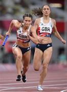 5 August 2021; Zoey Clark of Great Britain takes the baton from team-mate Emily Diamond during round one of the women's 4 x 400 metre relay at the Olympic Stadium on day 13 during the 2020 Tokyo Summer Olympic Games in Tokyo, Japan. Photo by Stephen McCarthy/Sportsfile