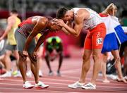 5 August 2021; Damian Warner of Canada is congratulated by Pawel Wiesiolek of Poland after winning the gold meldal in the Men's Decathlon during the 1500 metres of the men's decathlon at the Olympic Stadium on day 13 during the 2020 Tokyo Summer Olympic Games in Tokyo, Japan. Photo by Stephen McCarthy/Sportsfile