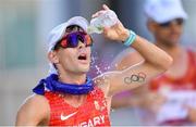 6 August 2021; Mate Helebrandt of Hungary pours water on his face in an attempt to cool down during the men's 50 kilometre walk final at Sapporo Odori Park on day 14 during the 2020 Tokyo Summer Olympic Games in Sapporo, Japan. Photo by Ramsey Cardy/Sportsfile