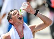 6 August 2021; Brendan Boyce of Ireland drinks water after finishing in 10th place during the men's 50 kilometre walk final at Sapporo Odori Park on day 14 during the 2020 Tokyo Summer Olympic Games in Sapporo, Japan. Photo by Ramsey Cardy/Sportsfile