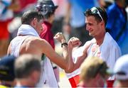 6 August 2021; Brendan Boyce of Ireland, left, and race winner Dawid Tomala of Poland fist bump after the men's 50 kilometre walk final at Sapporo Odori Park on day 14 during the 2020 Tokyo Summer Olympic Games in Sapporo, Japan. Photo by Ramsey Cardy/Sportsfile