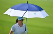 6 August 2021; Leona Maguire of Ireland uses an umbrella to shelter from the sun during round three of the women's individual stroke play at the Kasumigaseki Country Club during the 2020 Tokyo Summer Olympic Games in Kawagoe, Saitama, Japan. Photo by Brendan Moran/Sportsfile