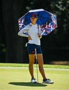 6 August 2021; Jessica Korda of USA uses an umbrella to shelter from the sun on the seventh green during round three of the women's individual stroke play at the Kasumigaseki Country Club during the 2020 Tokyo Summer Olympic Games in Kawagoe, Saitama, Japan. Photo by Brendan Moran/Sportsfile