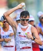 6 August 2021; Dawid Tomala of Poland cools himself with water during the men's 50 kilometre walk final at Sapporo Odori Park on day 14 during the 2020 Tokyo Summer Olympic Games in Sapporo, Japan. Photo by Ramsey Cardy/Sportsfile